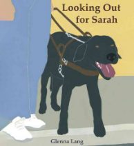 a book with a dog on a leash on cover tongue handing out